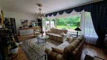 Wohnzimmer Wohnen direkt am Wald: Bungalow mit gro�em Grundst�ck in naturnaher Lage von M�lln zu verkaufen